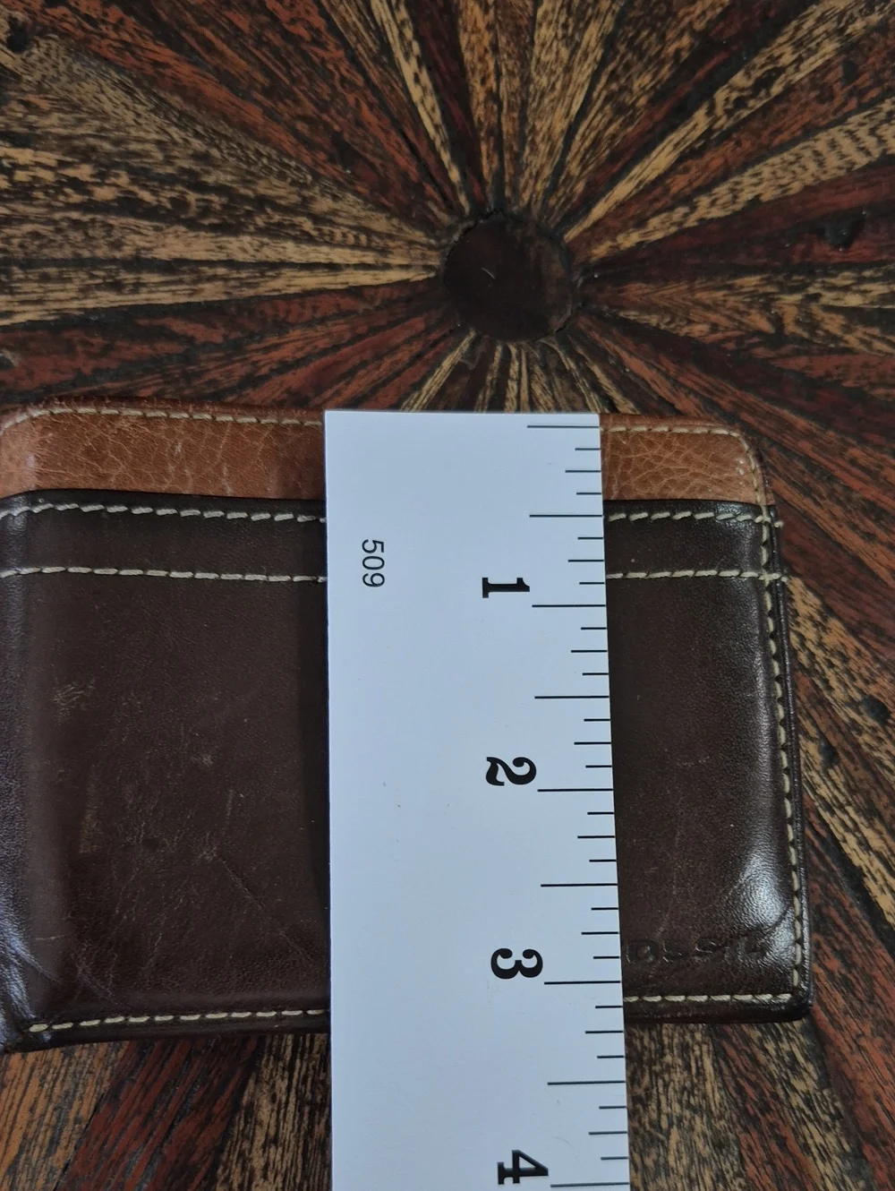 Fossil Brown and Tan Leather Bifold Wallet.
